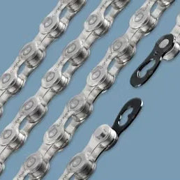 Close-up of silver bicycle chains with quick links on a blue background