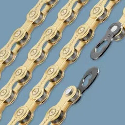 Gold bicycle chains with quick links on blue background, bike component detail