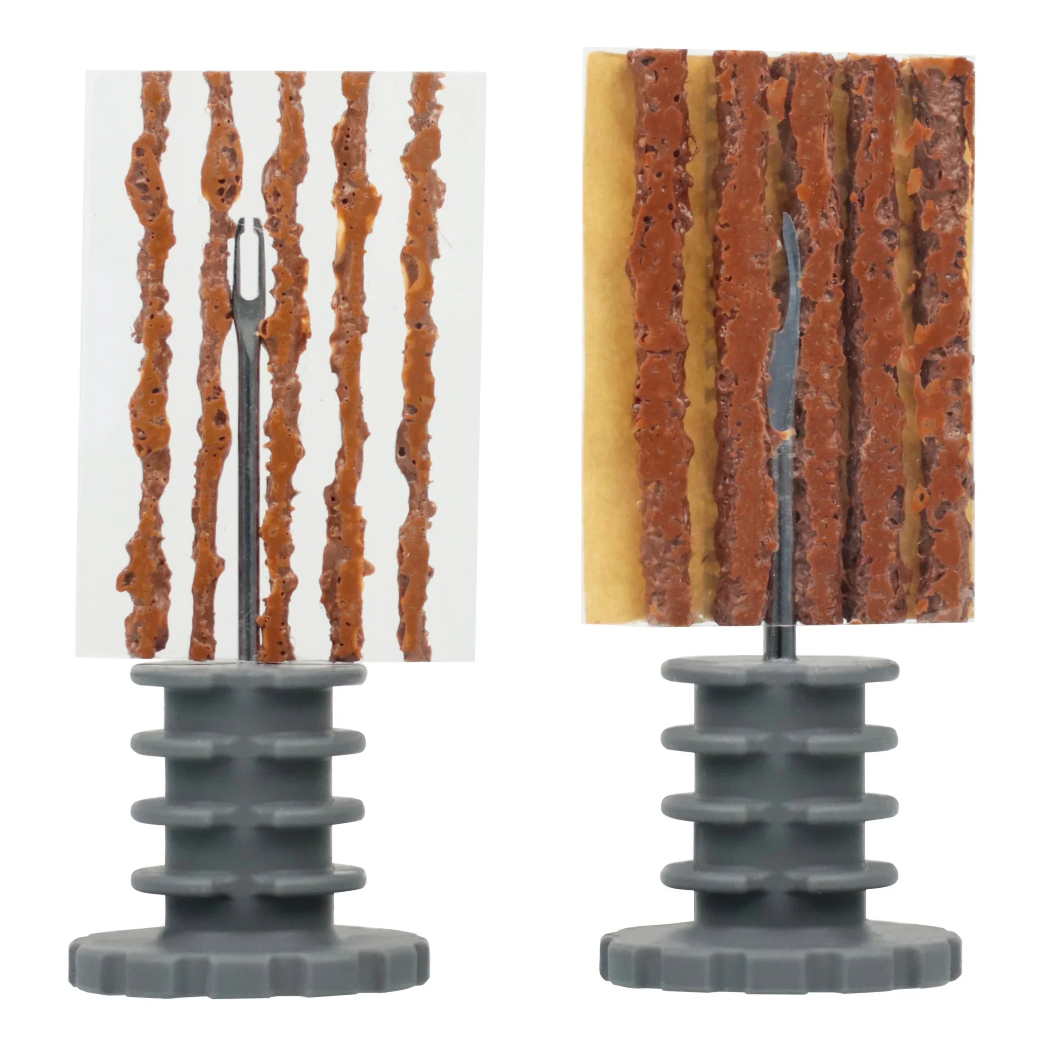 Tubeless tire repair plugs and tool kit, brown strips on gray handles, isolated on white