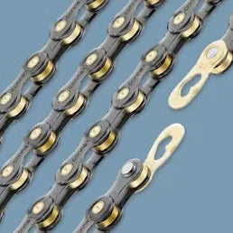 Bicycle chains with quick links on a blue background, close-up of chain details.