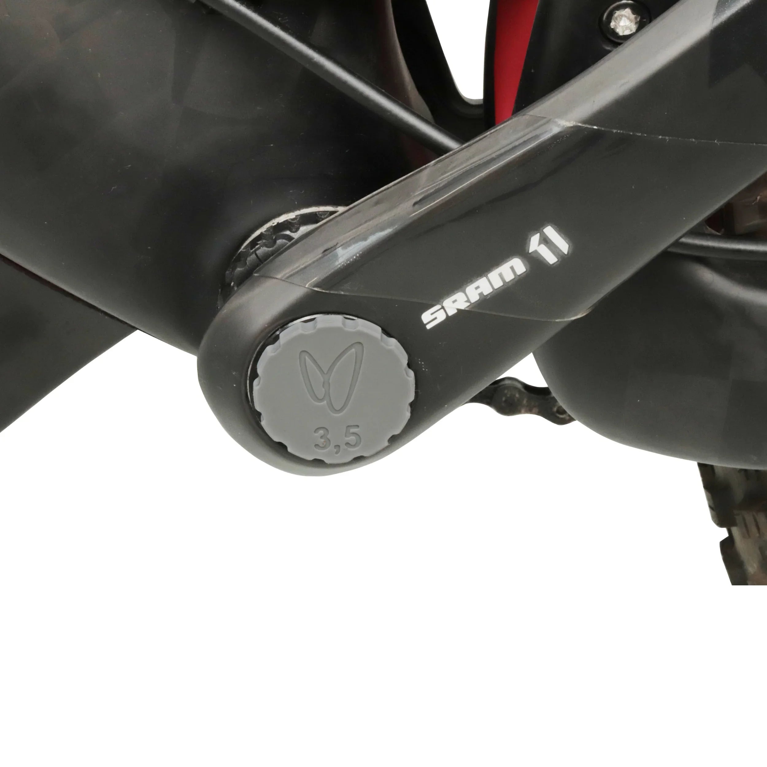 Close-up of SRAM bicycle crank arm with tubeless tire plug repair tool stored in center