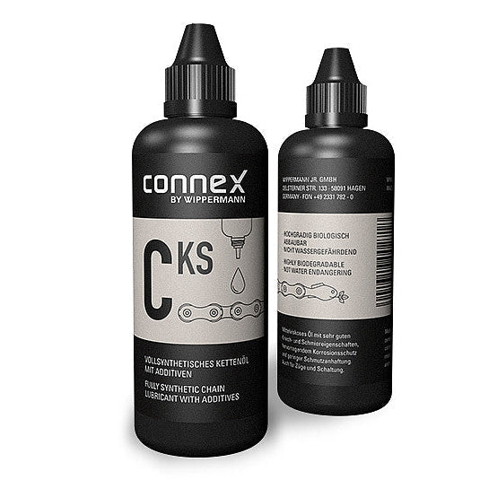 Two bottles of Connex CKS chain lube on a white background