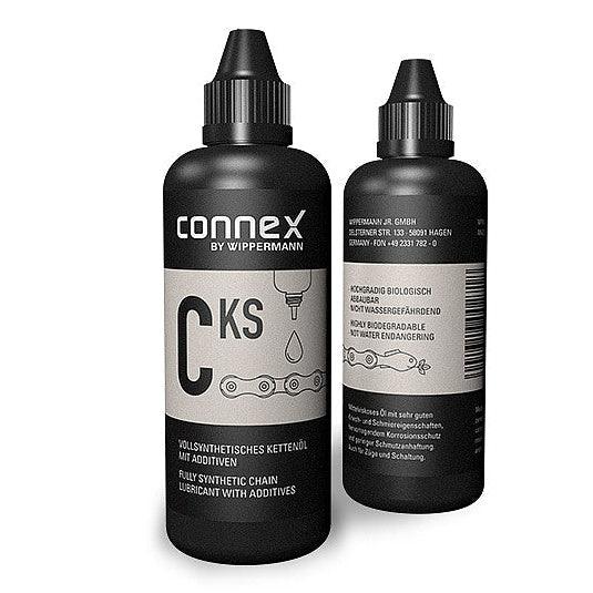 Two bottles of Connex CKS chain lube on a white background